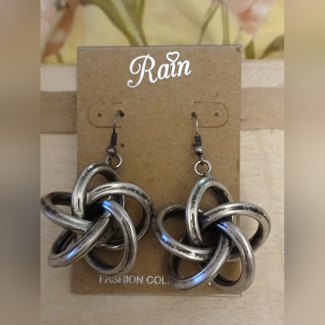 Silver Tone Knot Earrings New On Card 15$